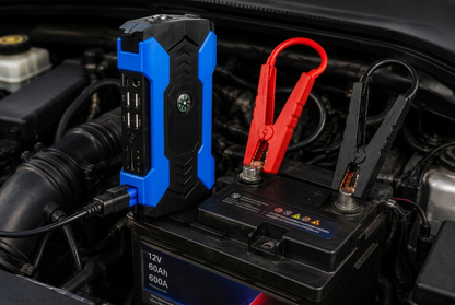 Jump starter connected to engine bay